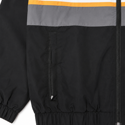 Close-up of a jacket with color-blocked design on a white background